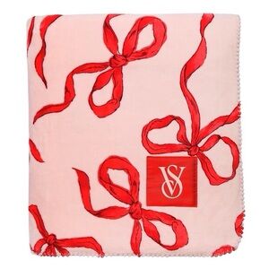 Victoria’s Secret sherpa blanket. Pink with red ribbon motive